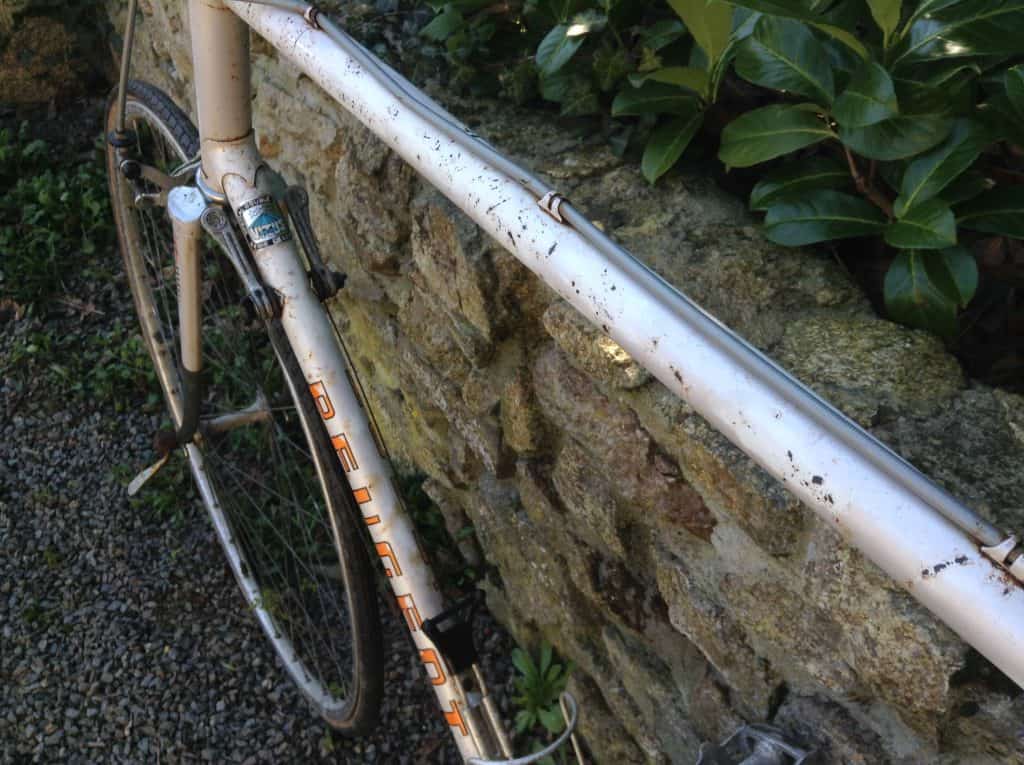 Close-up of top tube after removing rust from a bike frame