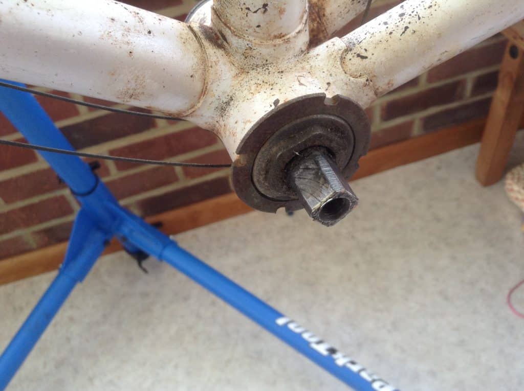 Bottom bracket after removing rust from a bike frame