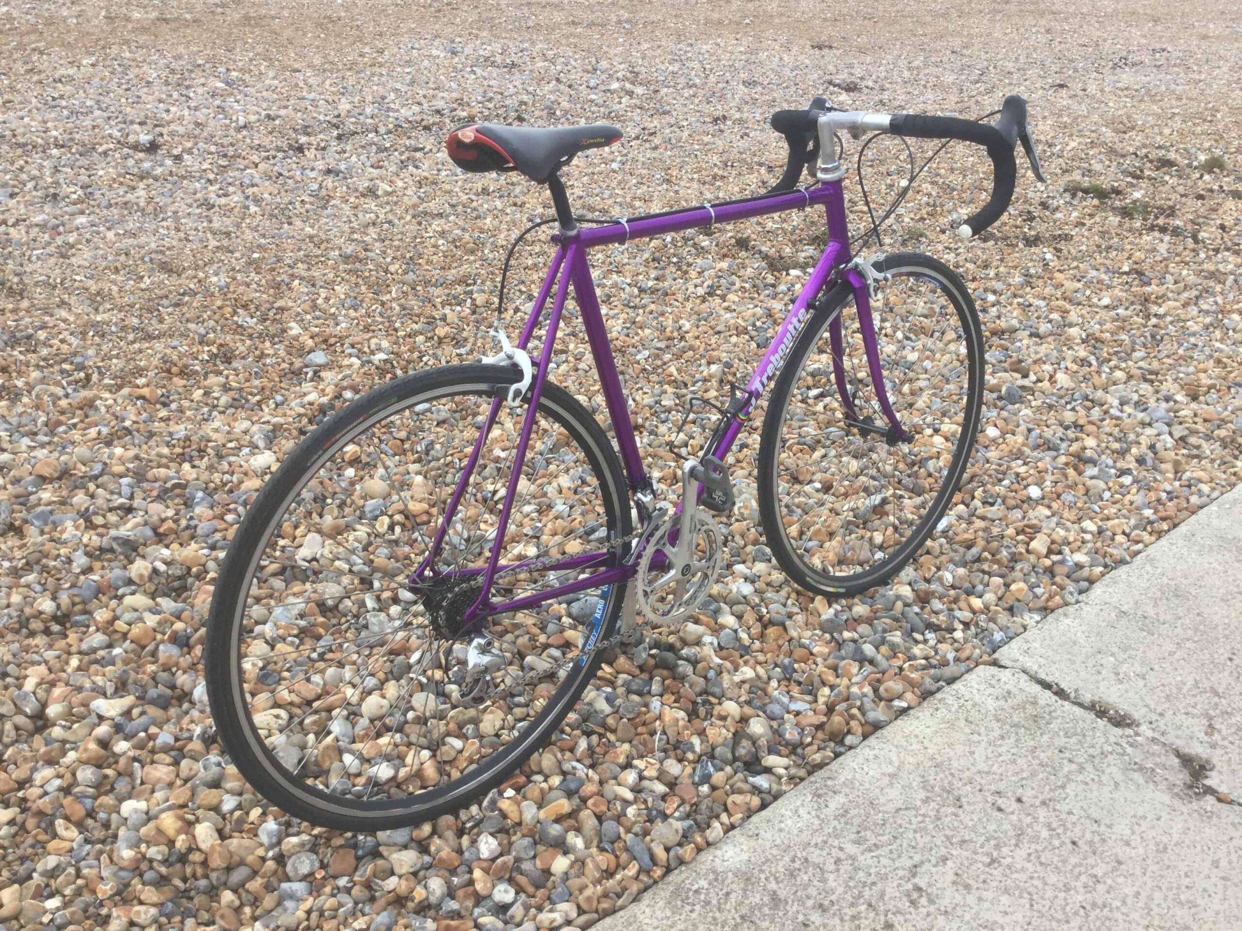  drive side image of purple bike