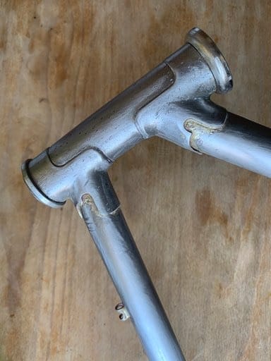 Sanded down headtube with lugs 