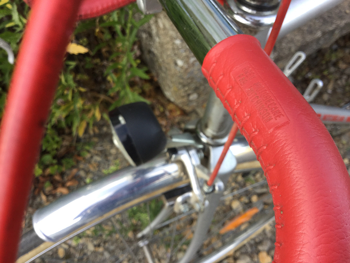 Close up image of Motobecane red handlebar grip